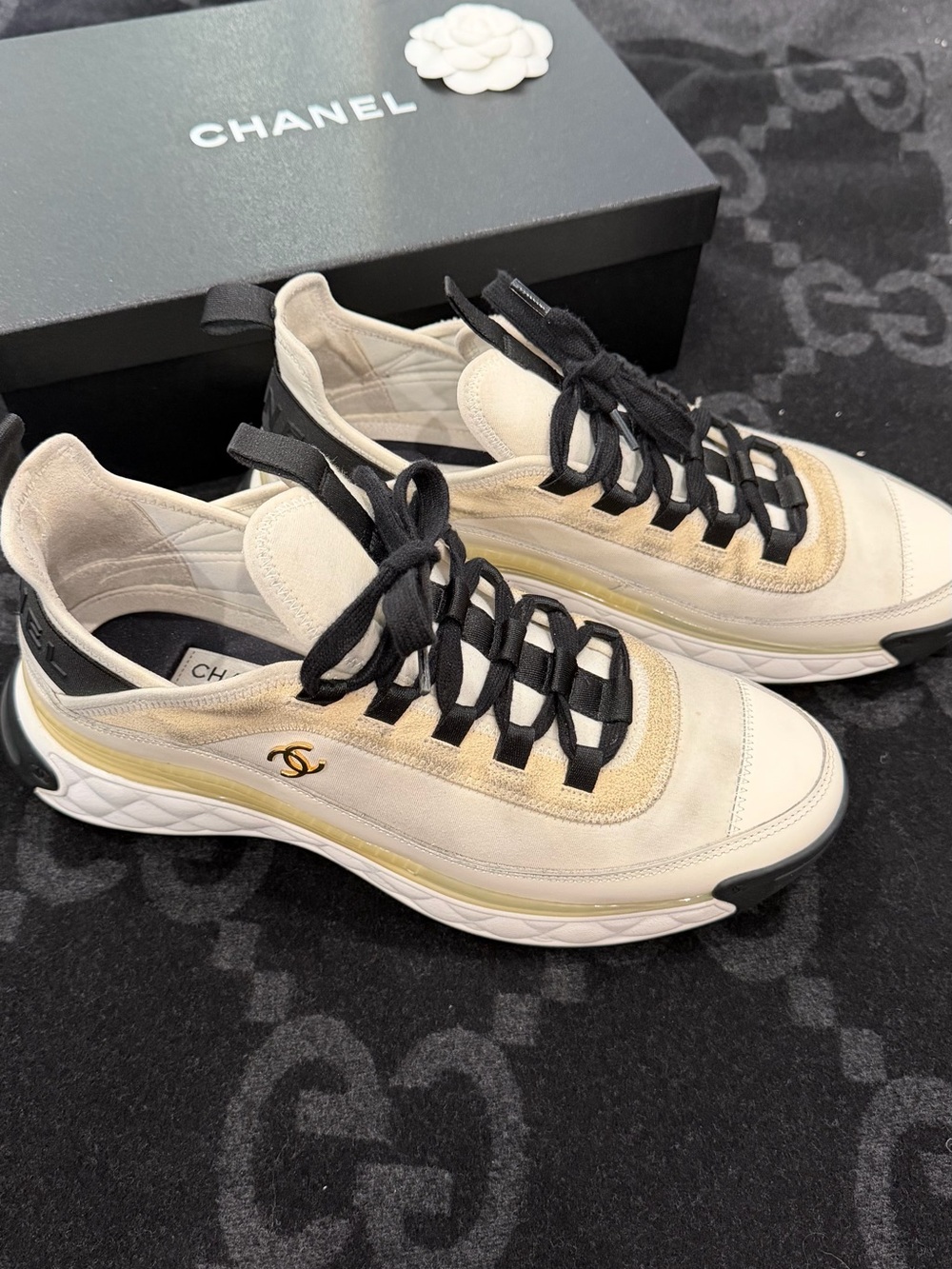 CHANEL Cream & Black Women’s Low-Top Sneakers with Gold Logo